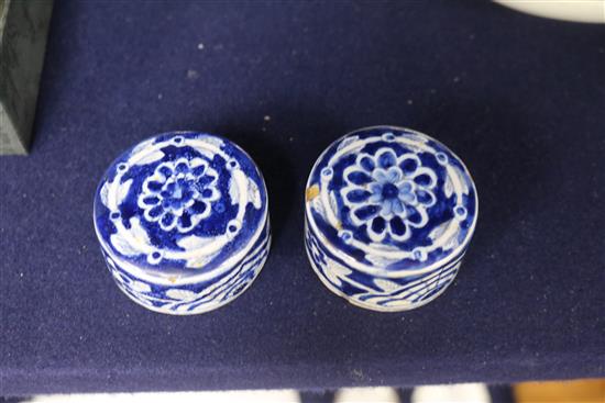 A pair of Dutch delft blue and white lidded tea caddies